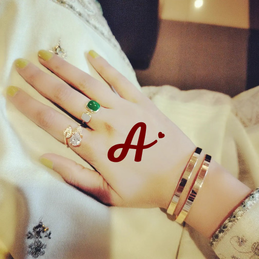 A love dp , a letter written on girl hand with love heart icon