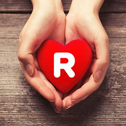 R name photo - heart in hand letter R white